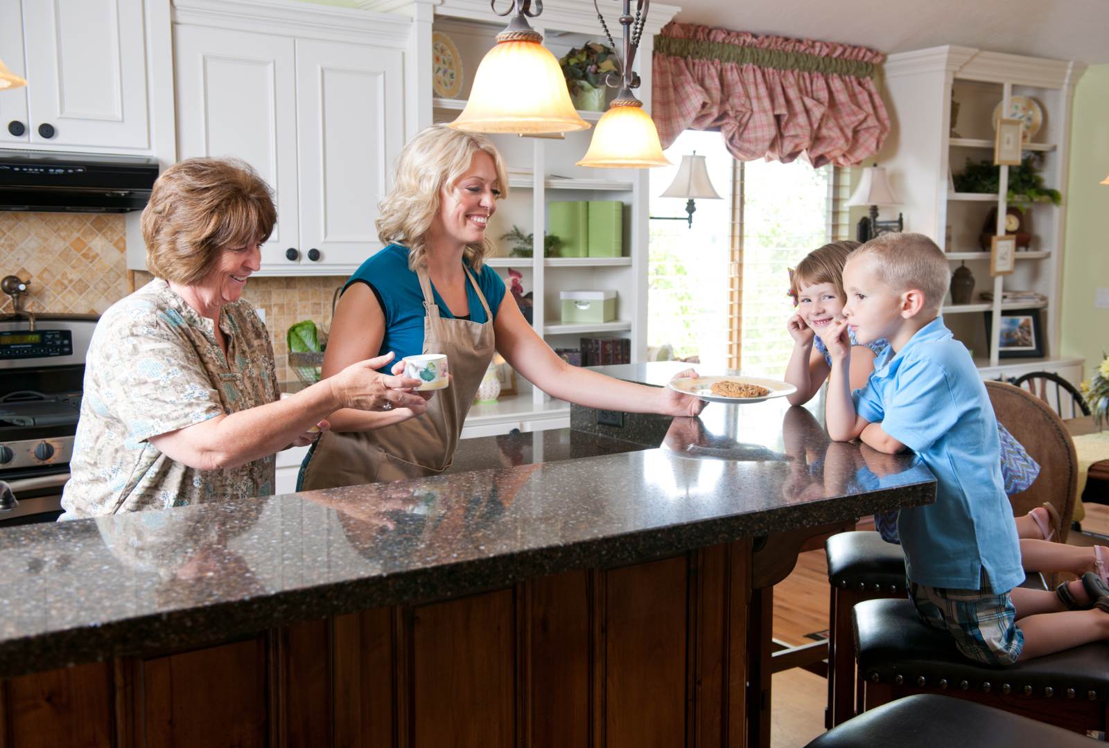 Family gathered around cookies in the kitchen