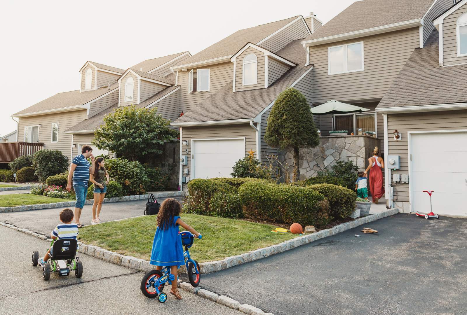 Neighbors talking and kids playing