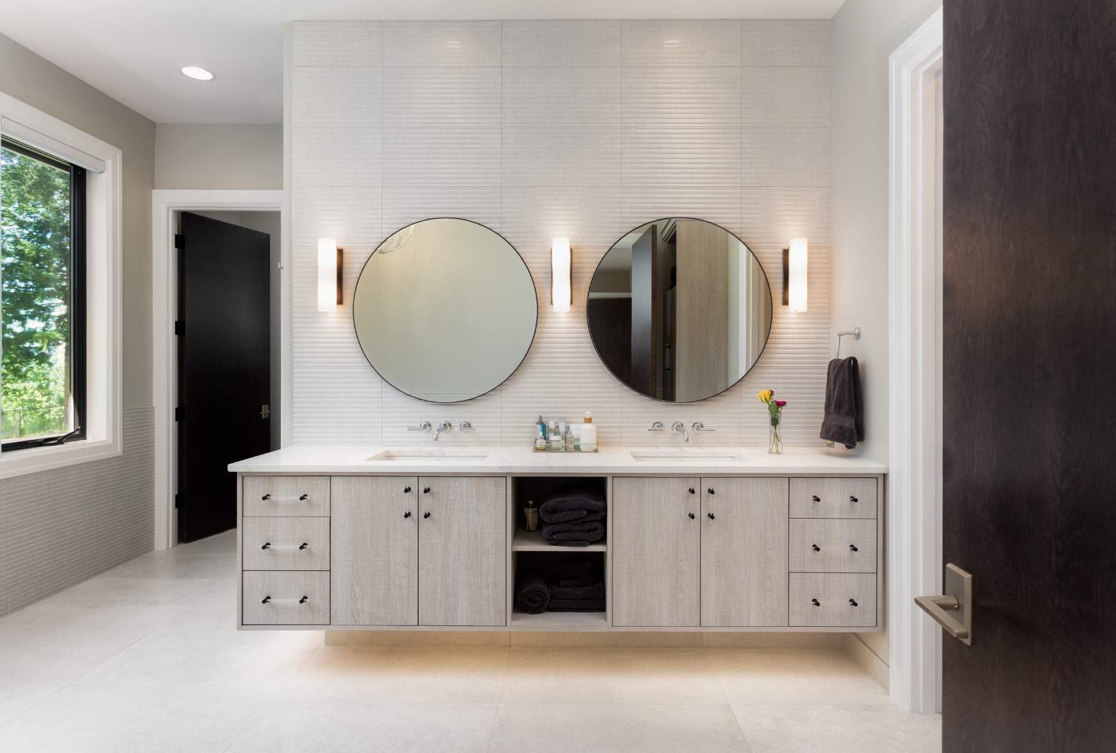 Elegant Bathroom with Two Sinks and Circular Mirrors