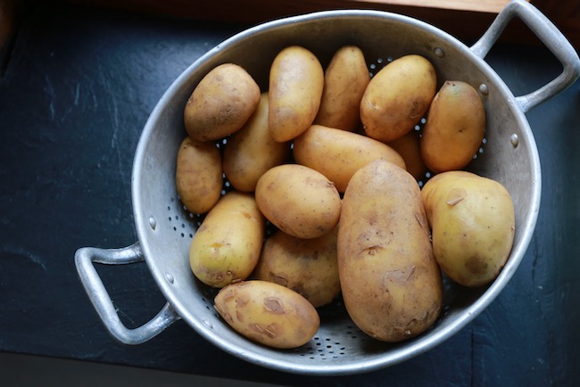 After cleaning and washing the potatoes