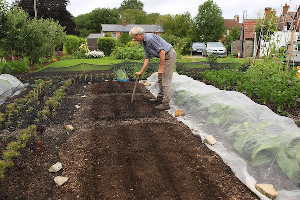 Charles marks lines with a dibber