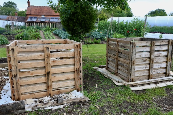 Compost heaps of pallets simply wired together, no stakes
