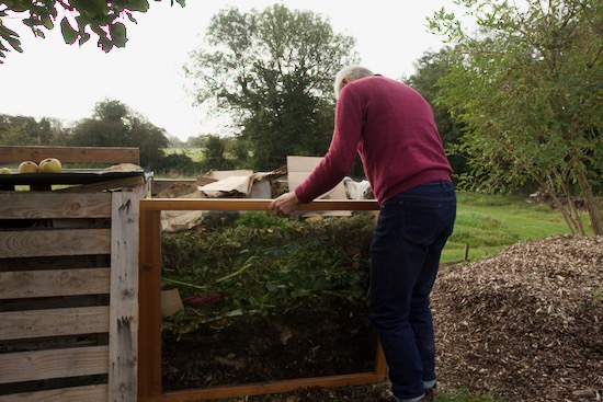 Placing glass window onto compost heap side