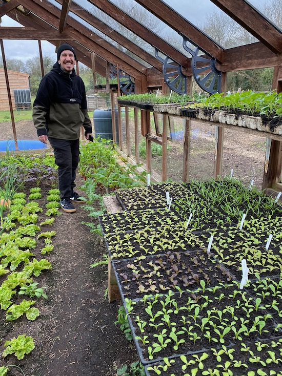 Alessandro in the greenhouse and so many seedlings