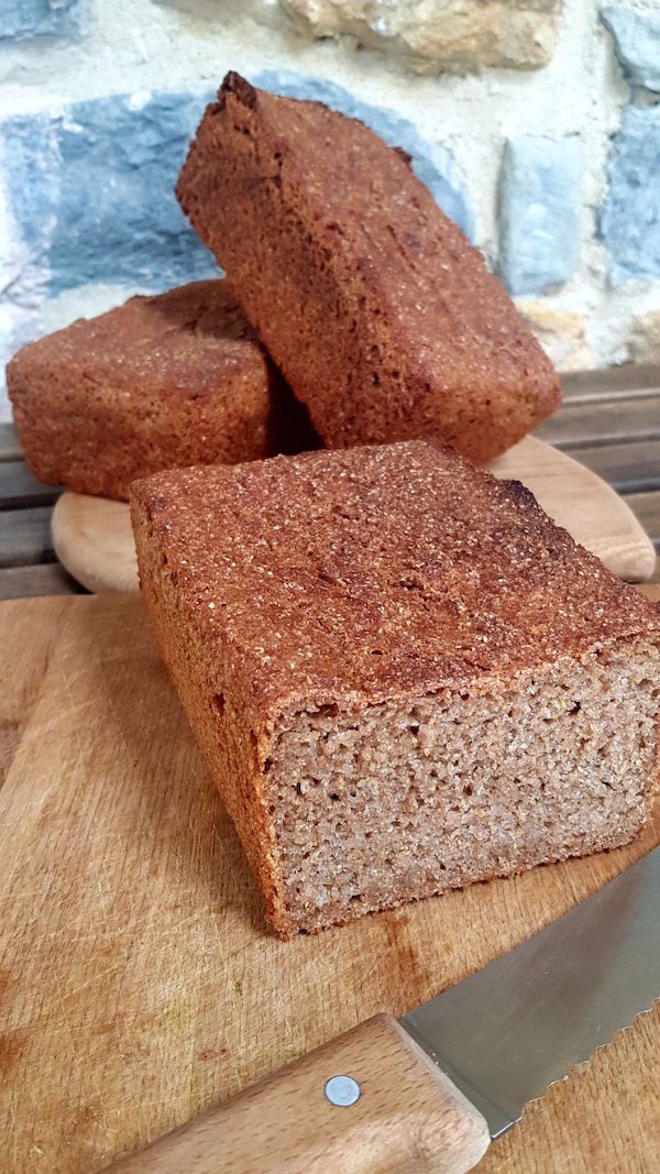 This bread is quick and simple to make, simply mixed by spoon with the sourdough starter, spooned into tins to rise overnight and baked in the morning. The flour is fresh ground in my little mill, 100% rye