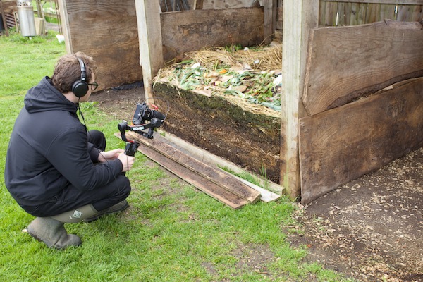 Edward filming compost heap profile after unscrewing planks, four months old at bottom, see video short