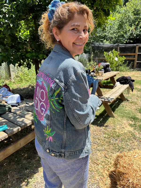 An attendee at Wini's event, and I signed her no dig jacket!