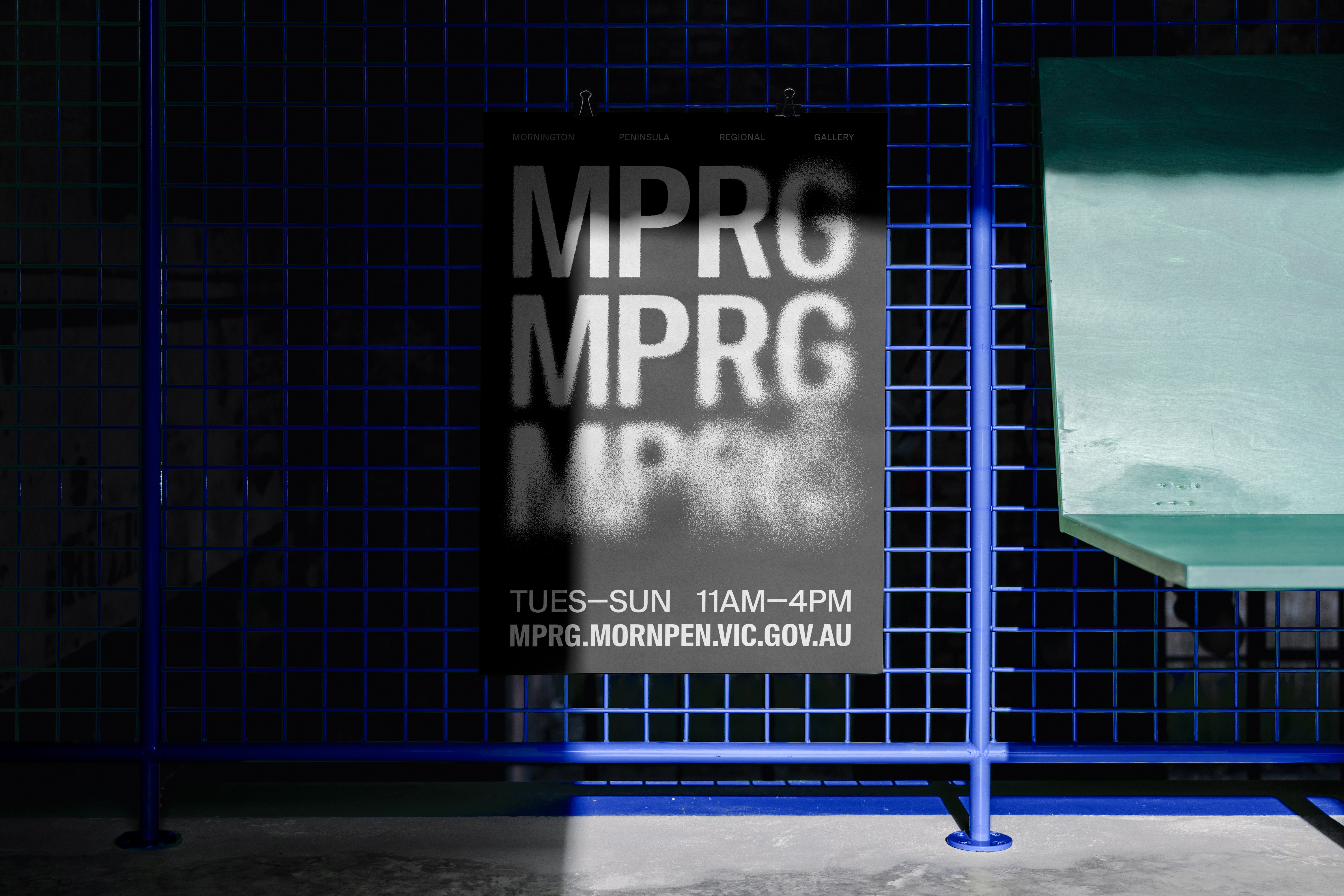 Black MPRG poster on a blue industrial background