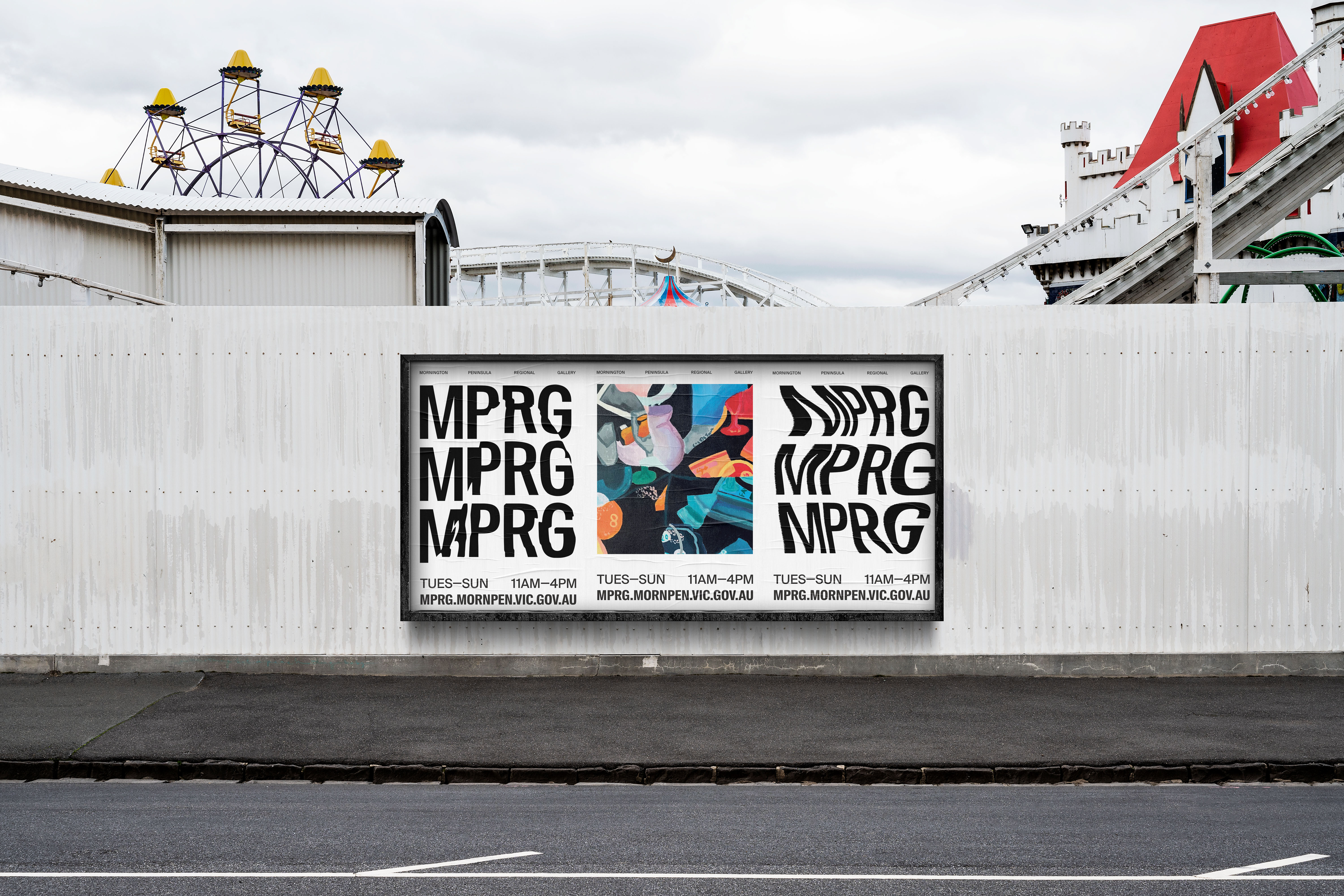 Three MPRG posters on the side of a theme park
