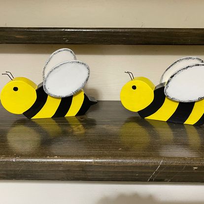 Cute bumble bees with wired antennae.