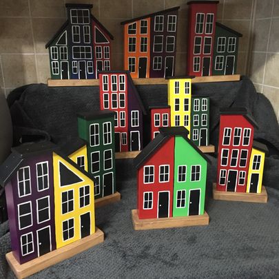 A selection of colourful wooden homes inspired by the jellybean row houses of Newfoundland.