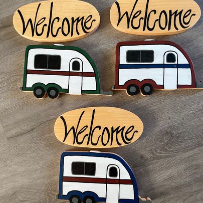 Welcome sign decorated with a camper/rv.
