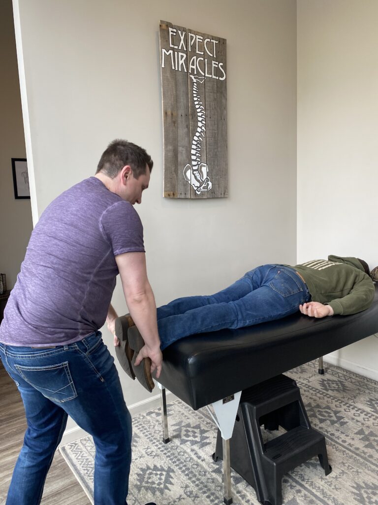 Chiropractor helping patient with post-accident recovery