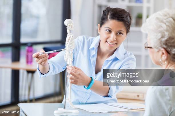 Chiropractor explaining treatment to patient