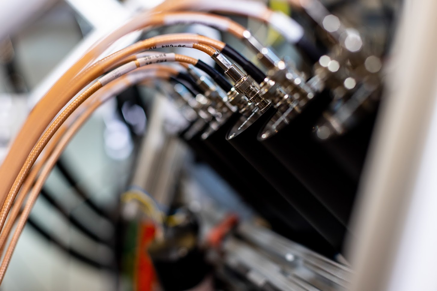 A row of at least five scintillator detectors are each connected by electric wire.