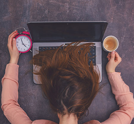 a woman with a laptop and coffee