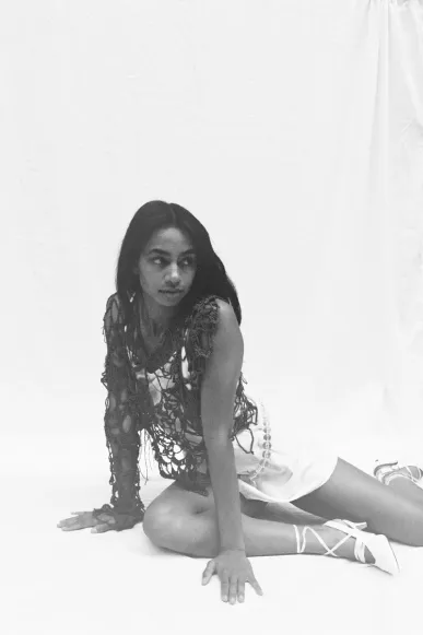 A picture of a girl wearing vine-style clothing