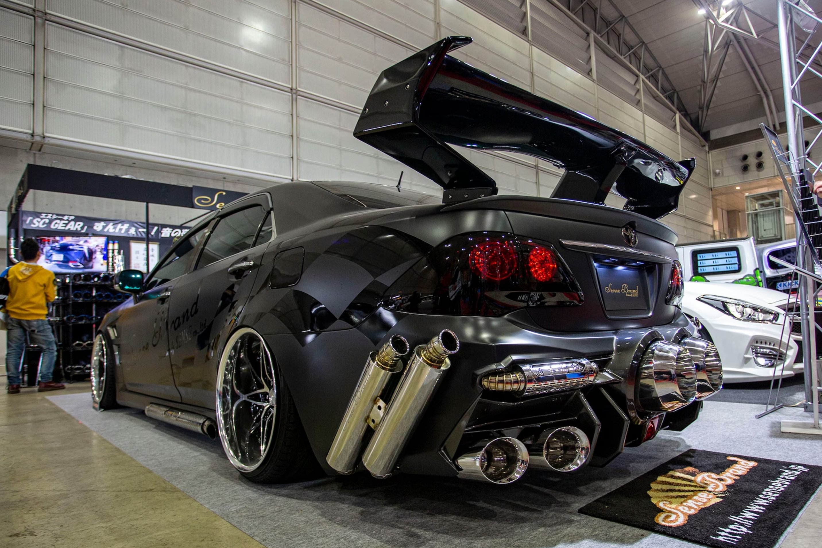 Toyota with lots of exhausts.