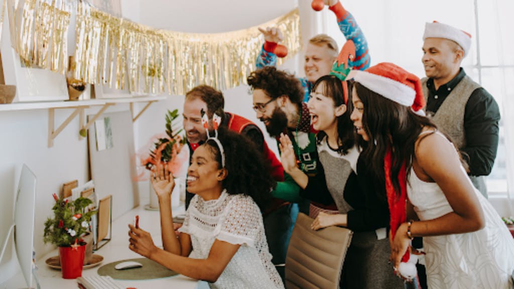 employees gathering in office for holiday party