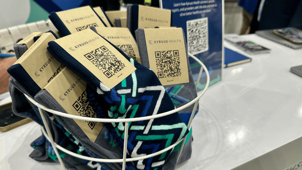 bowl of socks with QR code that are budget friendly swag and make a big impression