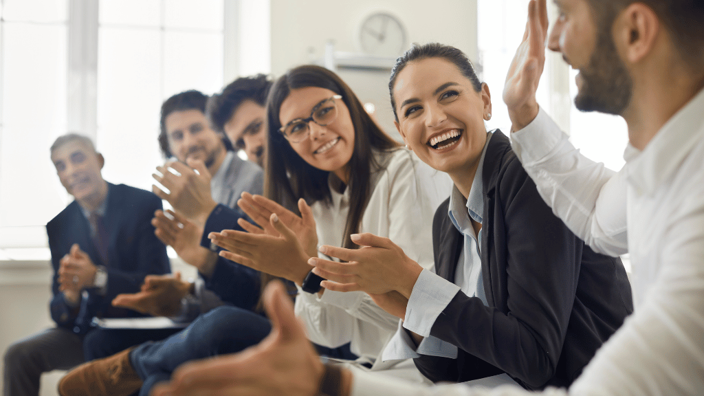 group of employees appreciating their coworker