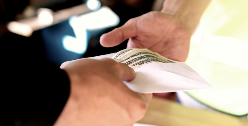 Close Up Of Owner Giving Money To Employee Or Hir 2023 11 27 04 57 11 Utc