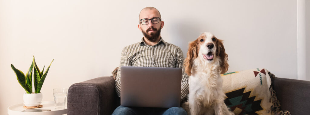 Man working from home with his dog: Eidl Update