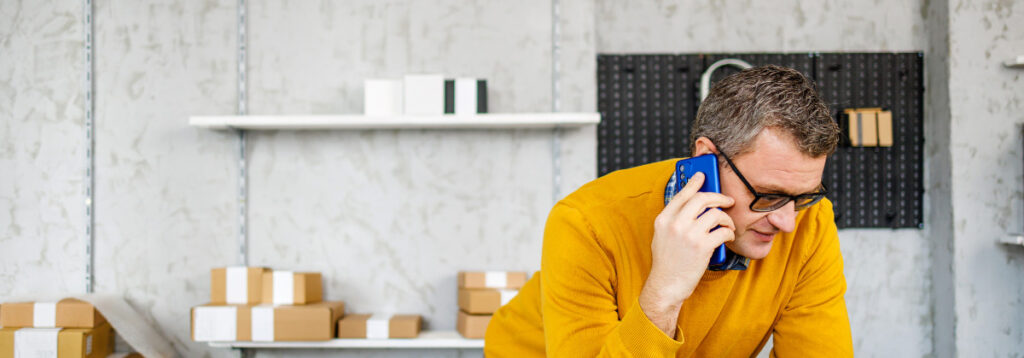 Man talking on the phone: Call The Sba