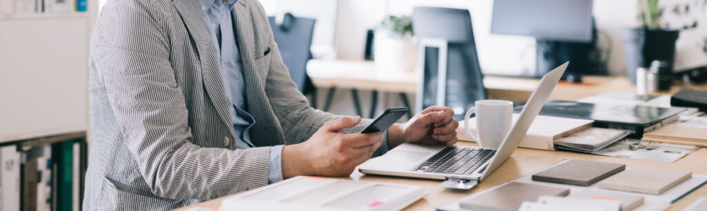 Man holding phone: New Sba Portal Blog Cm