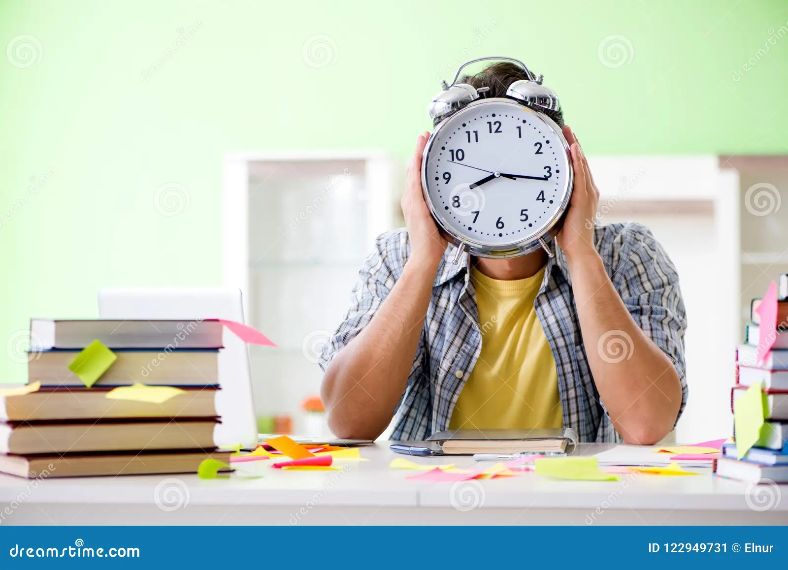 A student's desk with an open book, a planner, and a timer, representing time management skills
