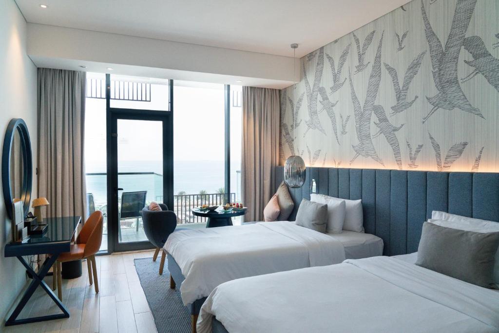 Luxurious beachfront hotel with modern amenities at C Central Hotel and Resort The Palm