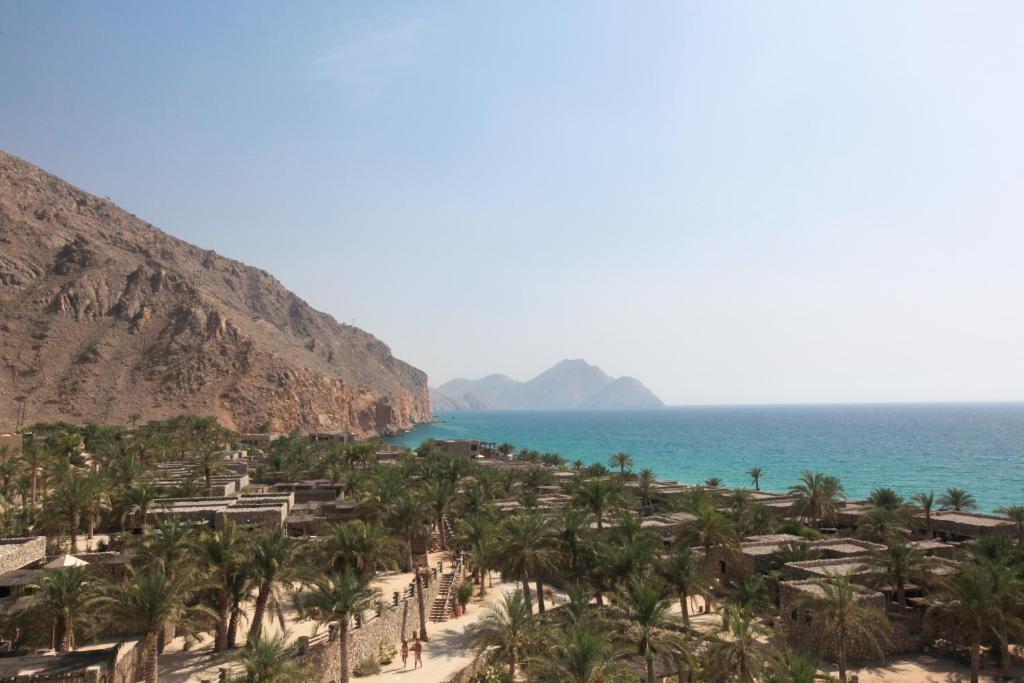 Luxurious beachfront resort with serene surroundings at Six Senses Zighy Bay