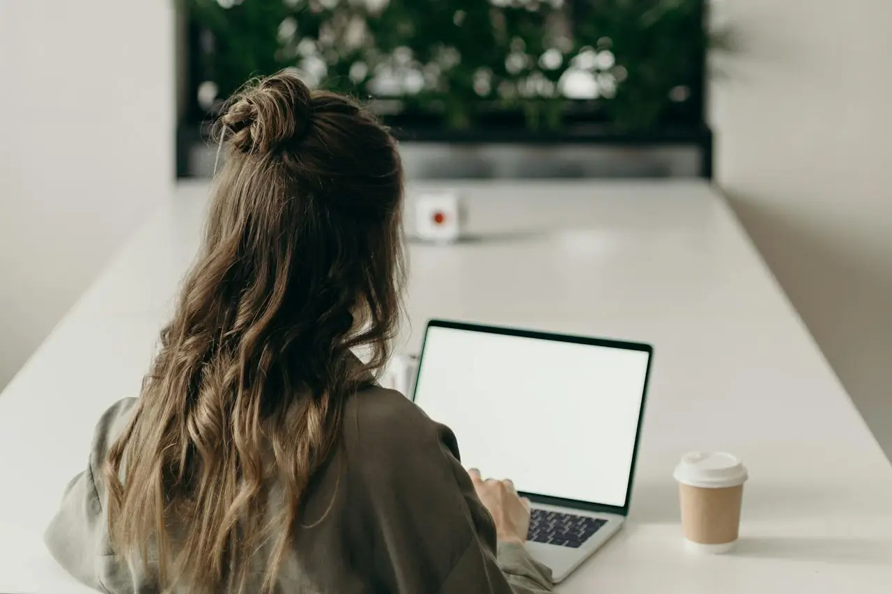 someone typing on a laptop
