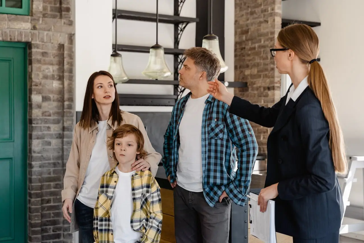 leasing agent showing a unit to a family
