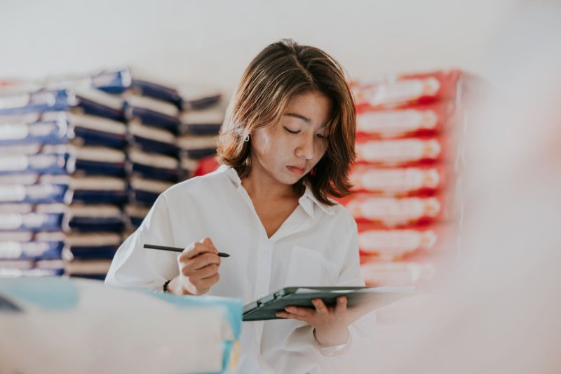 photo of food distributor doing a stock check on ipad